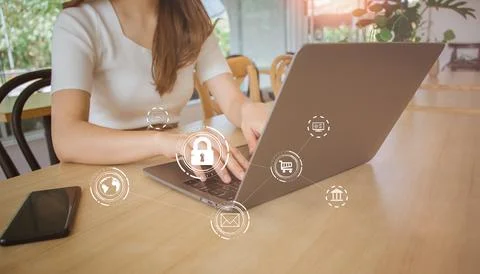 Female using computer laptop screen with padlock in cafe. user privacy secu.. Stock Photos