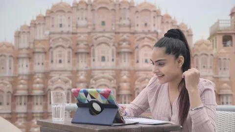 A female is using a digital tablet to interact with the business colleague Stock Footage 137819424