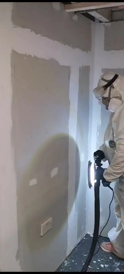 Female using Dry Wall Sander Stock Footage 257459931