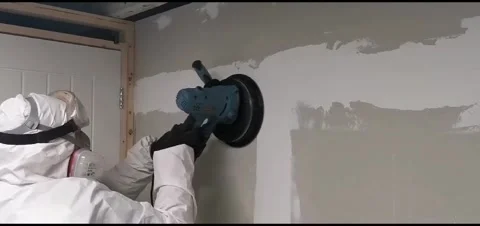 Female using Dry Wall Sander Stock Footage 257459949