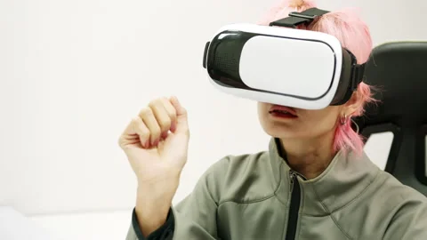 Female Using Gestures with Hands VR goggles headset modern technology Stock Footage 166438423