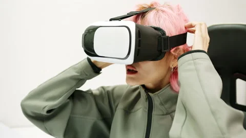 Female Using Gestures with Hands VR goggles headset modern technology Stock Footage 166438714