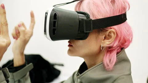 Female Using Gestures with Hands VR goggles headset modern technology Stock Footage 166440070