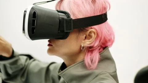 Female Using Gestures with Hands VR goggles headset modern technology Stock Footage 166440685