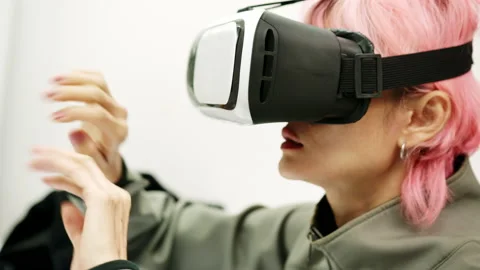 Female Using Gestures with Hands VR goggles headset modern technology Stock Footage 166441316