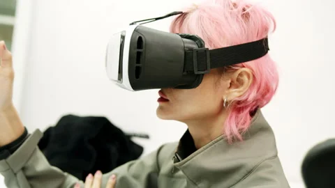 Female Using Gestures with Hands VR goggles headset modern technology Stock Footage 166441711