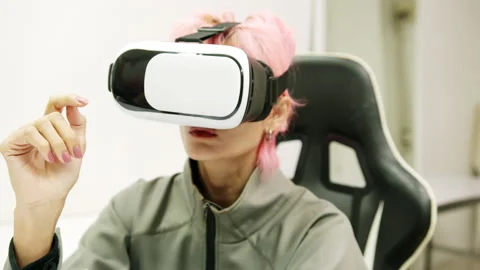 Female Using Gestures with Hands VR goggles headset modern technology Stock Footage 166442009