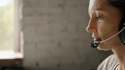 Female using headset and microphone to speaking with people Stock Footage 108791137