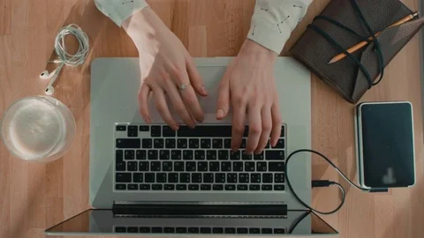 Female Using Her Laptop On The Table Stock Footage 76872704