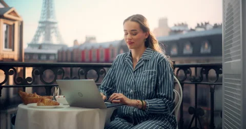 Female Using Laptop on Paris Balcony Stock Footage 296172659