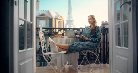Female Using Laptop on Paris Balcony Stock Footage 296173084