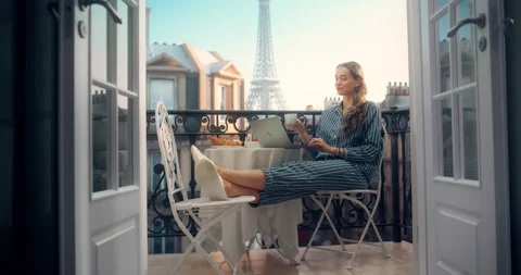 Female Using Laptop on Paris Balcony Stock Footage 296173174