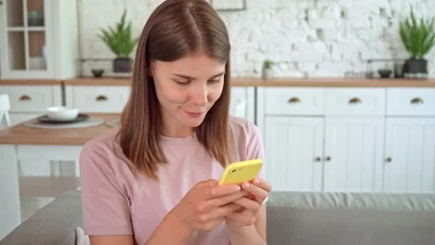 Female using mobile in apartment Stock Footage 166685646
