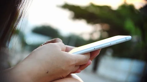 Female using mobile application in smartphone Stock Footage 89259622