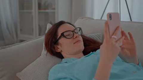 Female using mobile at home Stock Footage 250324092