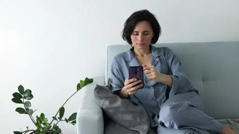 Female using phone texting message scrolling tapping technology Stock Footage 196968775