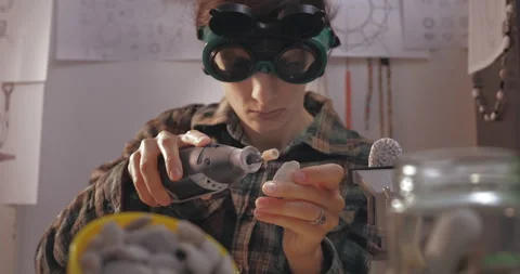 Female using pilers to producing jewelry from beads. Stock Footage 143208425