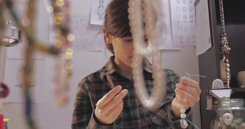 Female using scissors to cut during producing bracket. Stock Footage 143209189