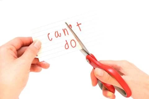 Female using scissors to remove the word can't to read I can do it concept fo Stock Photos