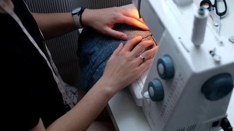 Female using sewing machine Stock Footage 89154328