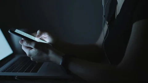Female using smartphone in evening Video stock 70788486