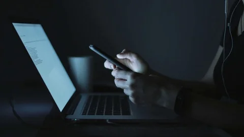 Female using smartphone in evening 스톡 동영상 70788488