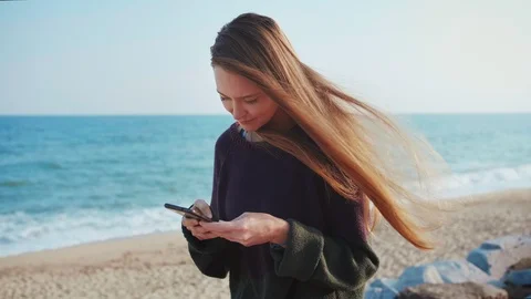 Female using smartphone or mobile social network app texting to beloved friend Stock Footage 100452385