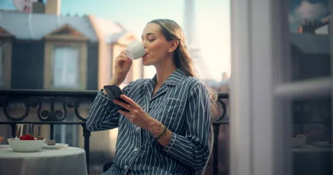 Female Using Smartphone on Paris Balcony Stock Footage 296172864