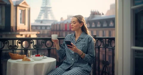 Female Using Smartphone on Paris Balcony Stock Footage 296172874