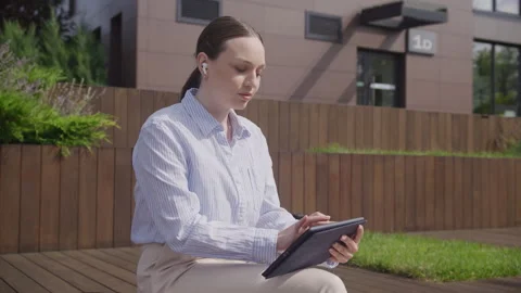 Female Using Tablet Computer Reading World News Online Stock Footage 278099316