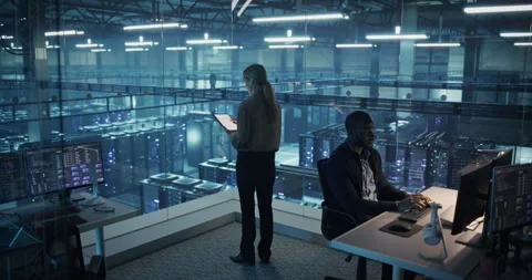 Female Using Tablet in Data Center Office Stock Footage 296175114