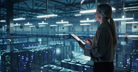 Female Using Tablet in Data Center Office Stock Footage 296175345