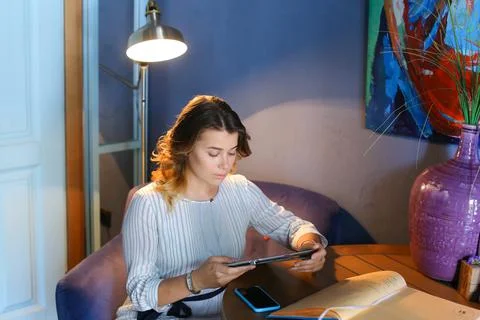 Female using technology in cafe phone tablet Stock Photos