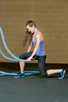 Female Using Training Ropes Stock Photos