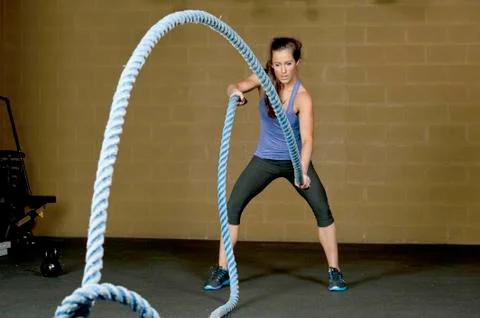 Female Using Training Ropes Stock Photos