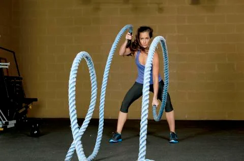Female Using Training Ropes Stock Photos