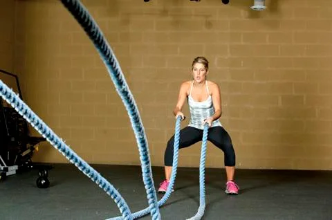 Female Using Training Ropes Stock Photos