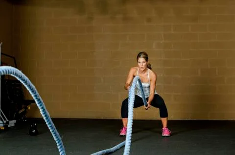 Female Using Training Ropes Stock Photos
