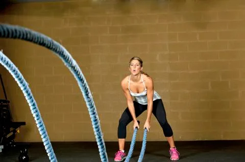 Female Using Training Ropes Stock Photos