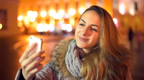 Female using video chat on cell phone Stock Footage 60404473