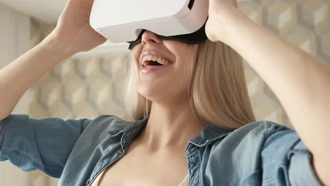 Female using the virtual reality headset at home. Stock Footage 85693013