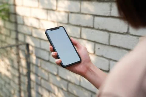Female Viewing blank white phone screen Stock Photos