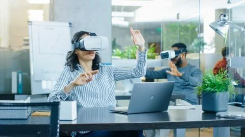 Female Virtual Reality Engineer/ Developer Wearing Virtual Reality Headset Stock Photos
