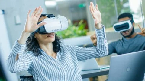 Female Virtual Reality Engineer/ Developer Wearing Virtual Reality Headset Stock Photos