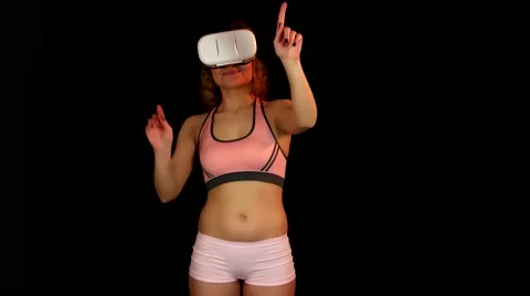 Female in the virtual reality headset pushing buttons on virtual interface Stock-Footage 62343966