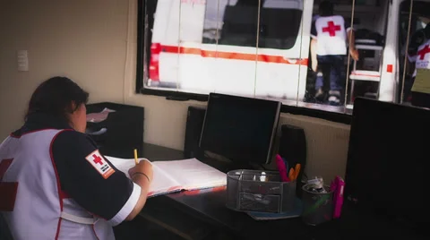 Female volunteer in red cross Stock Footage 34899853