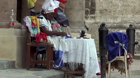 Female voodoo priests preparing their table in havana,cuba Stock Footage 38813616