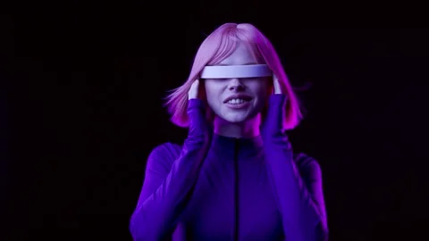 Female in VR glasses interacting with network while having virtual reality. Stock Footage 261286639