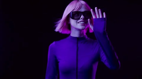 Female in VR glasses interacting with network while having virtual reality. Stock Footage 261287366