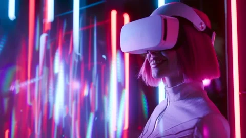 Female in VR glasses interacting with network while having virtual reality. Stock Footage 261956525